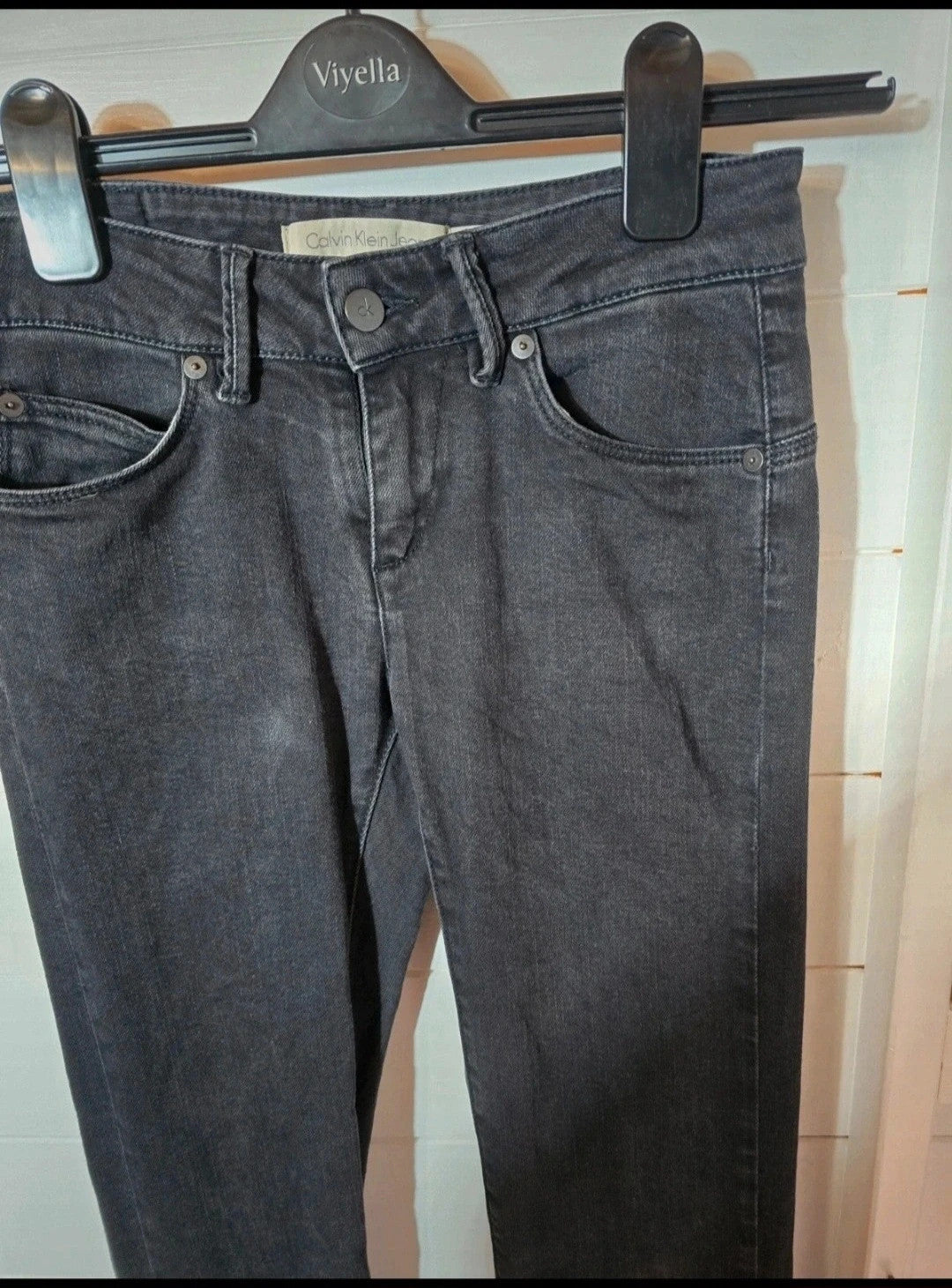 Calvin Klein black faded slim leg jeans W25"