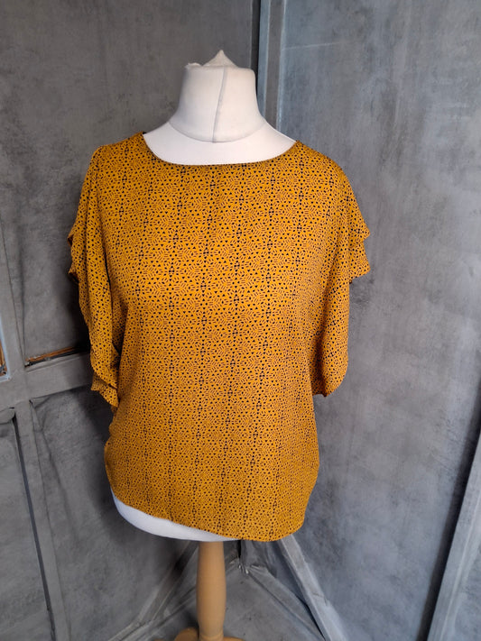 Easy Wear Orange & Black Patterned Top – Size 12 – Frilly Sleeve Button Back

